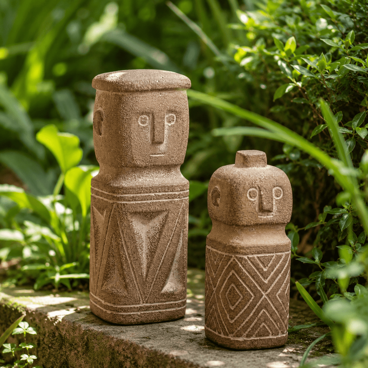 Two garden character figures on a stone ledge