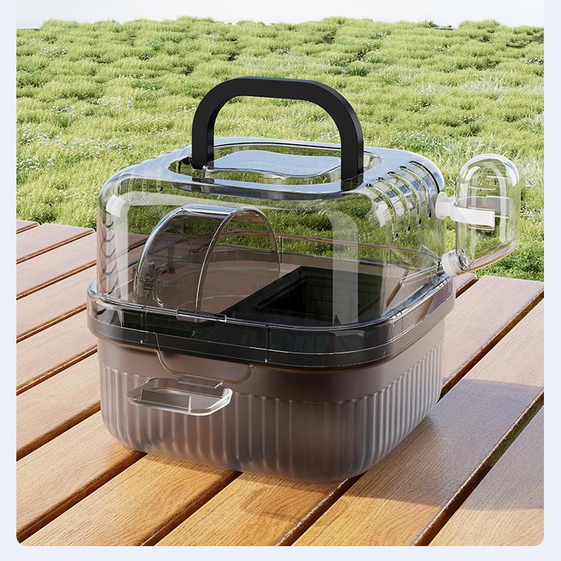 Clear portable hamster travel cage with dome lid, handle and ventilation holes