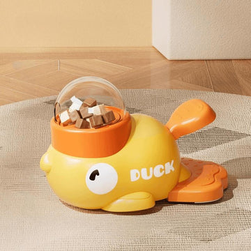 Yellow duck-shaped treat dispenser toy with interactive puzzle design