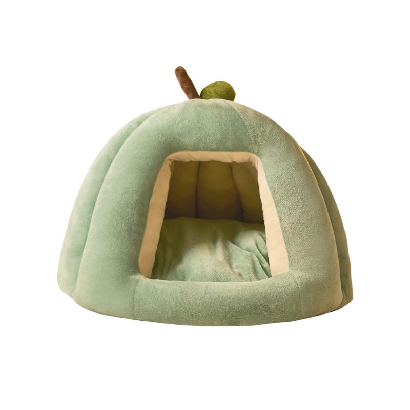 Green pumpkin-shaped pet cave bed with warm plush interior for cats and small dogs
