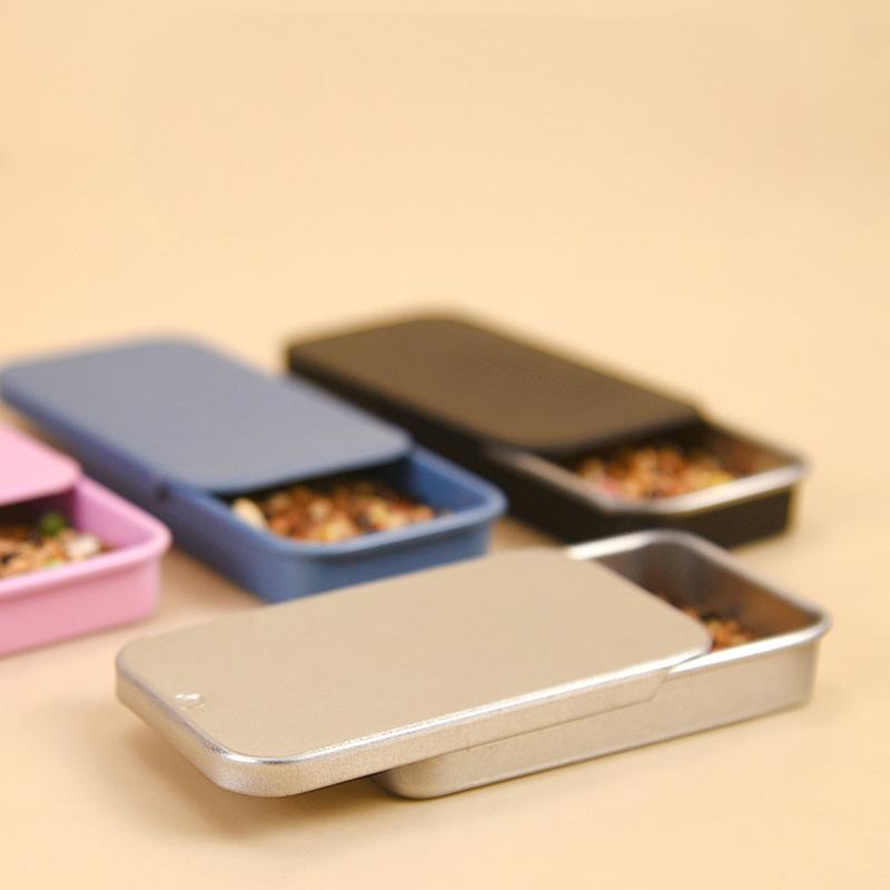 Black slide metal bird training feeder with compartments for treats